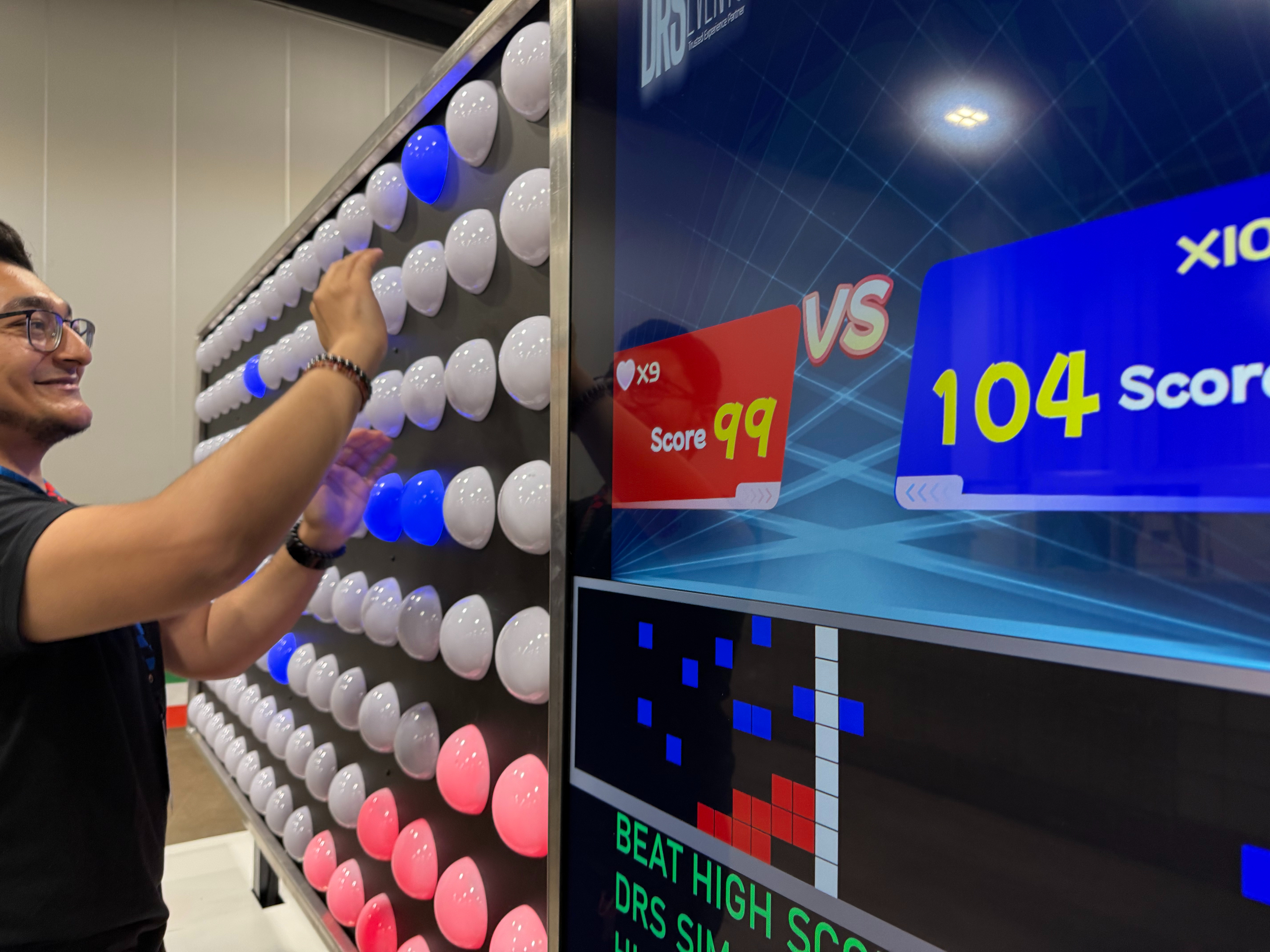 Reaction Labs players competing on the reaction wall